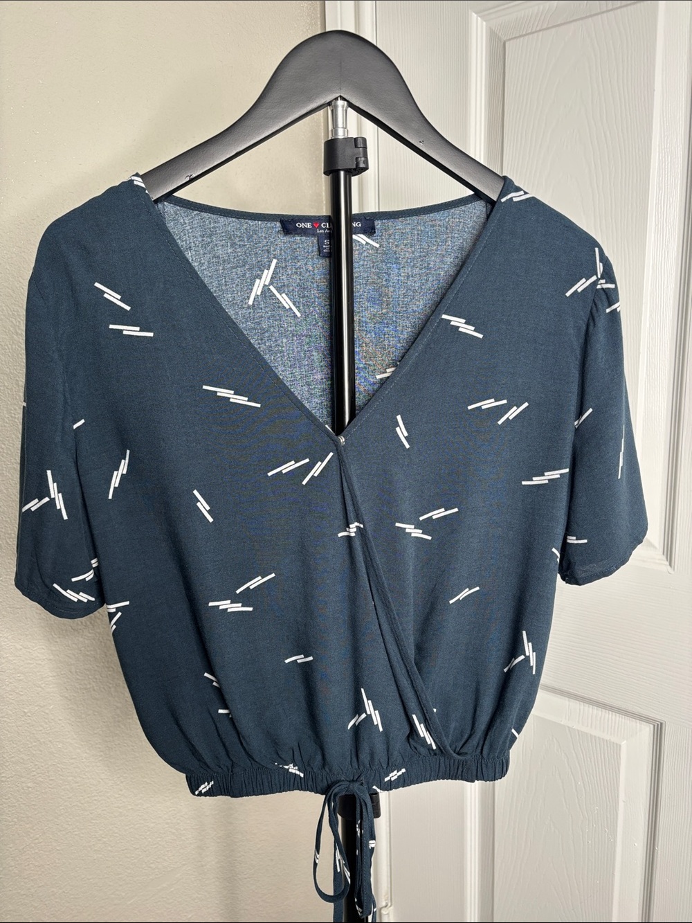 One Clothing navy blue V-neck drawstring cropped blouse with white dash print